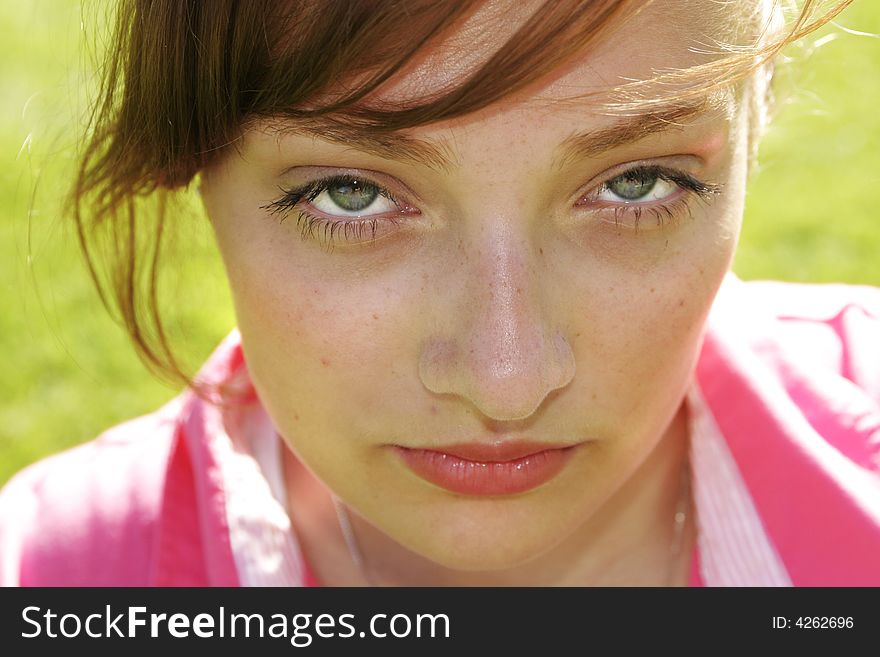 Closeup of teenage girl in pink shirt. Closeup of teenage girl in pink shirt