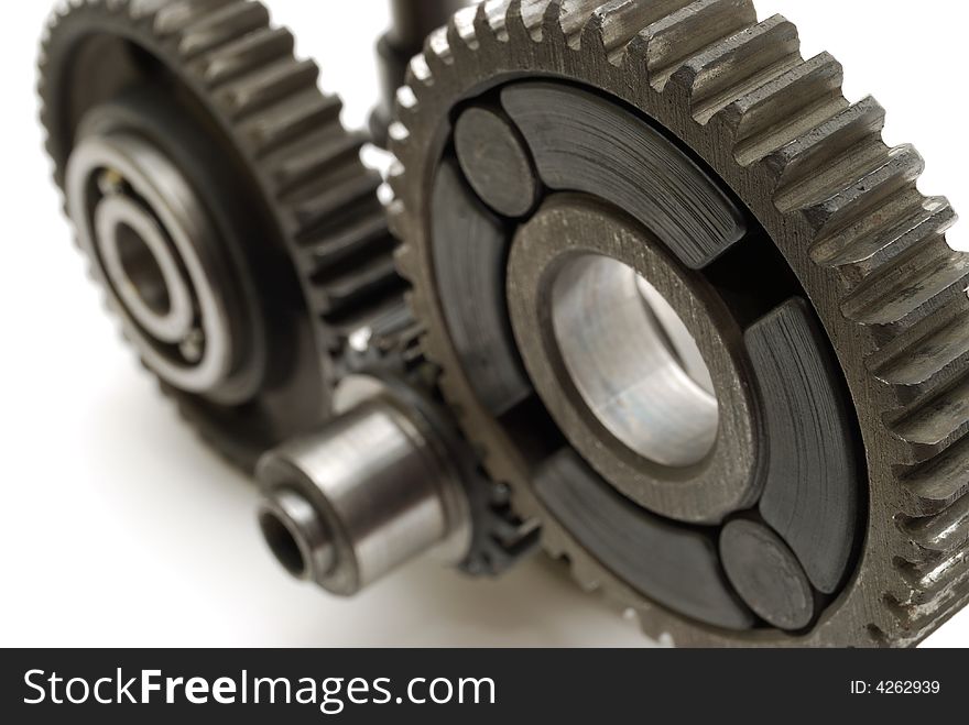 Gears and bearings connecting on white background