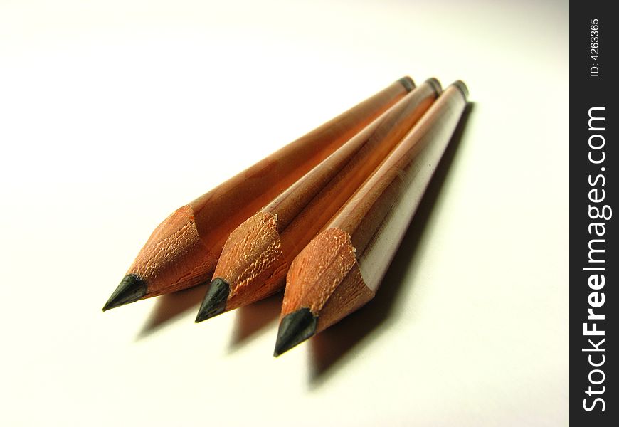 A macro shot of big charcoal pencils viewed from their lead tips. A macro shot of big charcoal pencils viewed from their lead tips.
