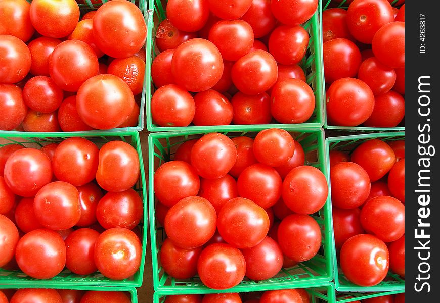 Cherry tomatoes in their plastic containers at the market