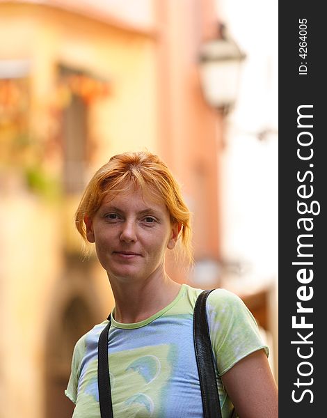 Pretty red-headed girl on street