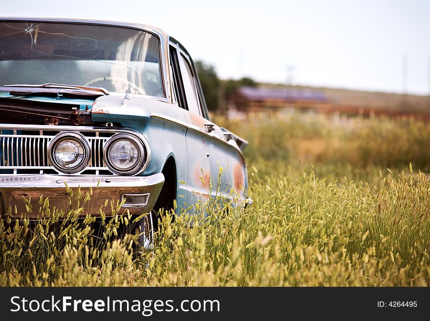 Abandoned classic car in a field in rural Wyoming. Abandoned classic car in a field in rural Wyoming