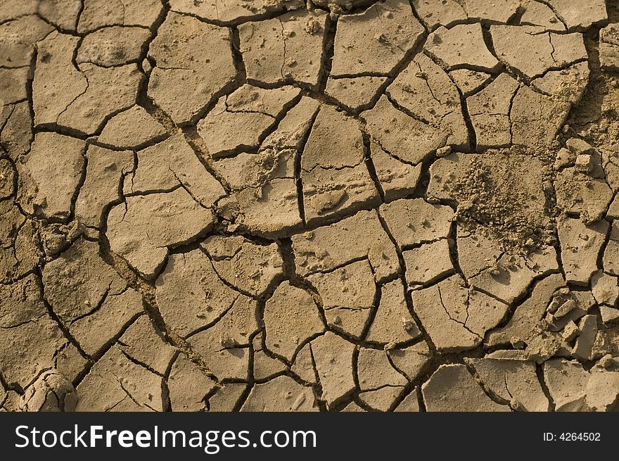 Detail of dried soil with cracked surface. Detail of dried soil with cracked surface