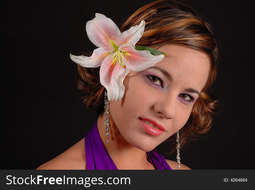 Portrait of beautiful female with lily flower on head. Portrait of beautiful female with lily flower on head