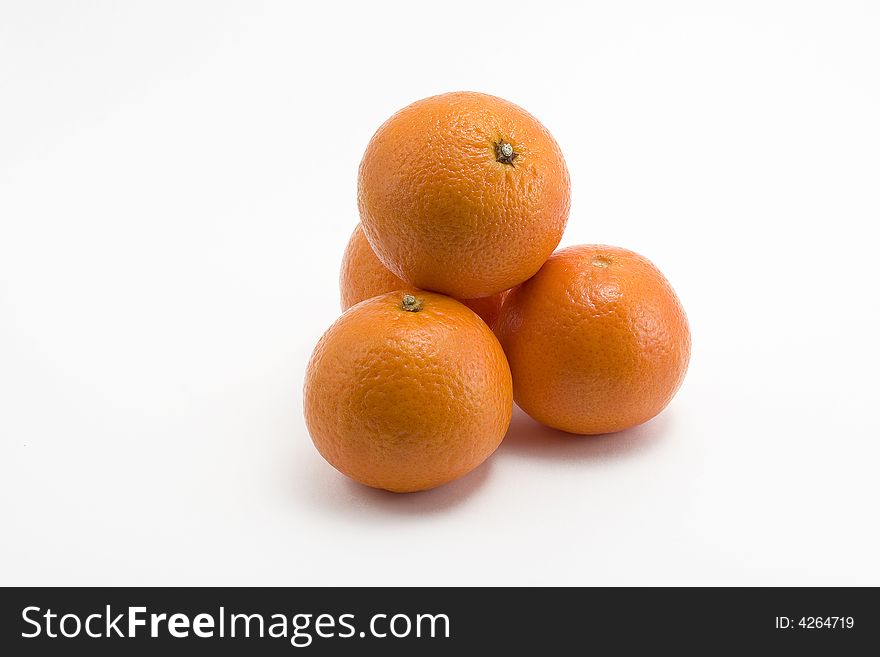 Four fresh and sweet mandarines over white background. Four fresh and sweet mandarines over white background