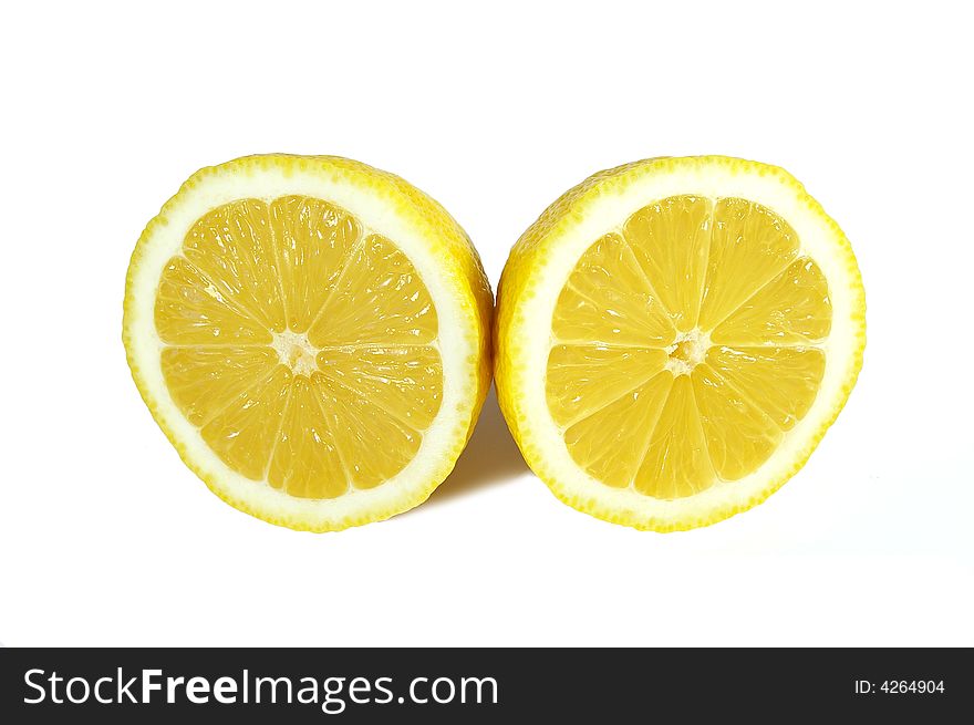 Two halfs of yellow ripe lemon on white background. Two halfs of yellow ripe lemon on white background