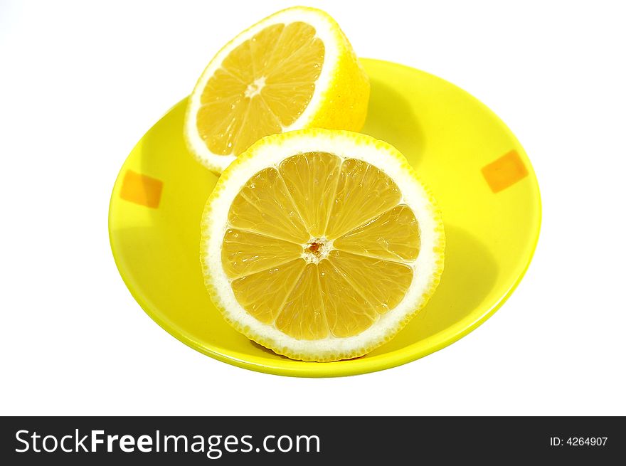 Two halfs of yellow ripe lemon on white background