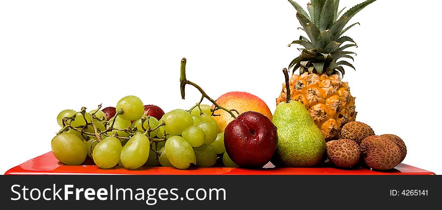 Fresh Fruit On A Red Dish.