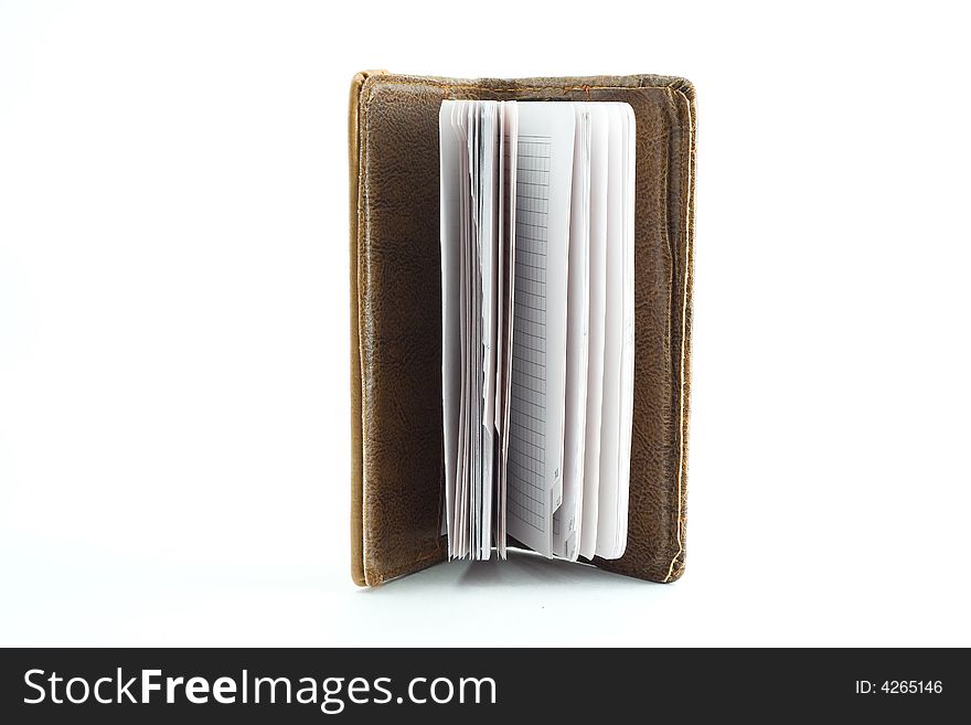 One notebook at leather cover isolated on white