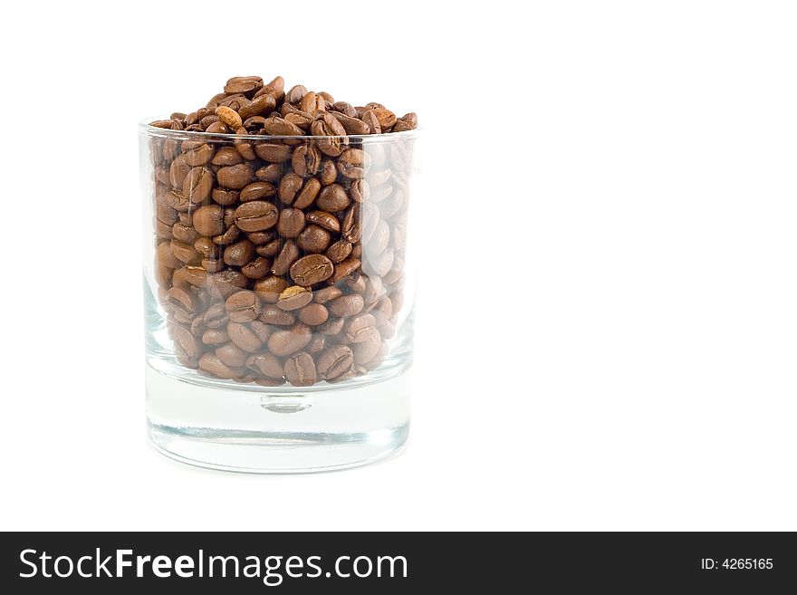 Transparent glass with coffee-beans isolated on white