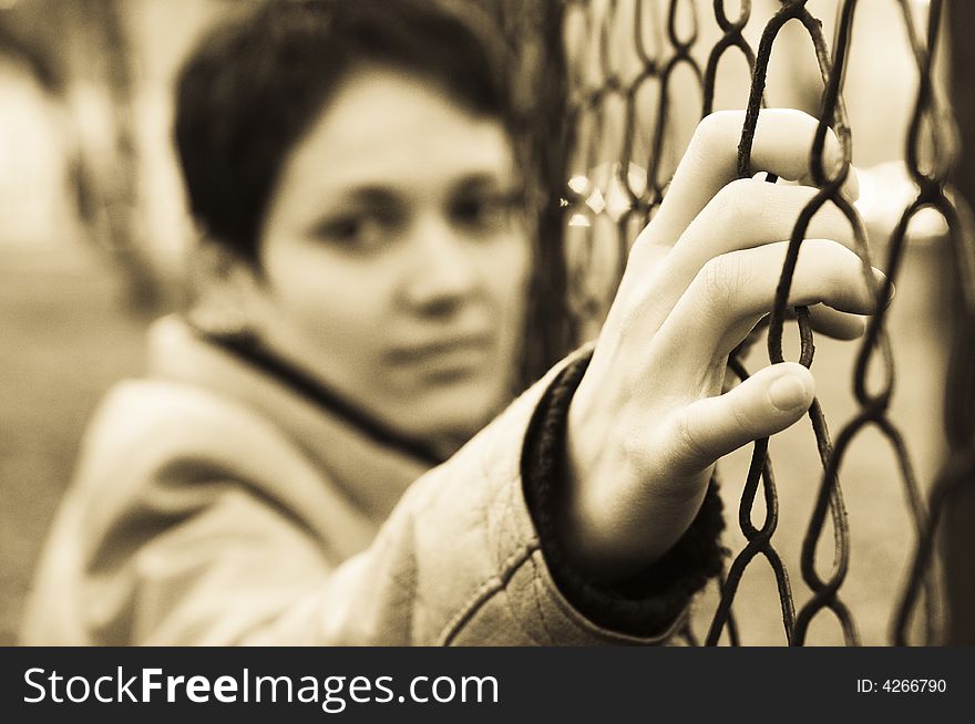 A view with woman behind bars. A view with woman behind bars