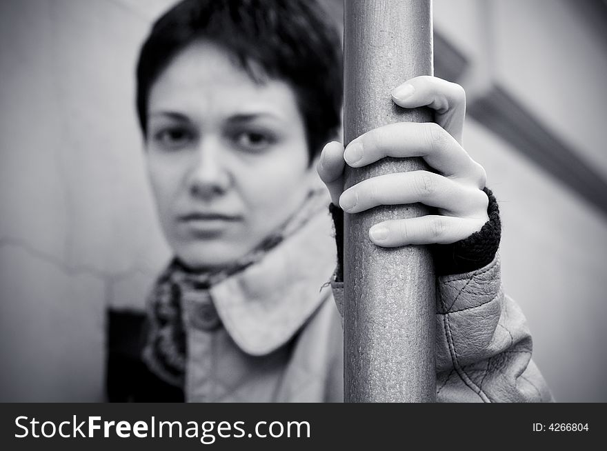 A view with a woman looking  thoughtful in black and white tones.