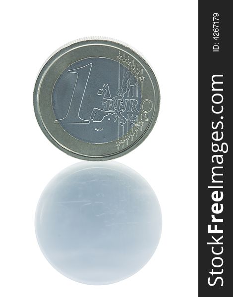 Single euro coin standing on edge with reflection
