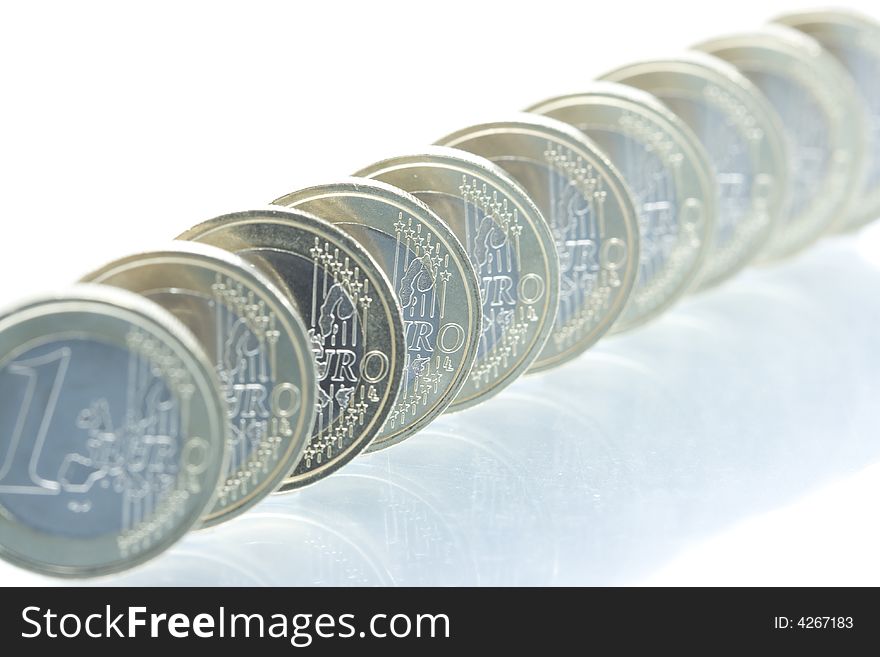 Euro coins line pattern with reflection. Euro coins line pattern with reflection