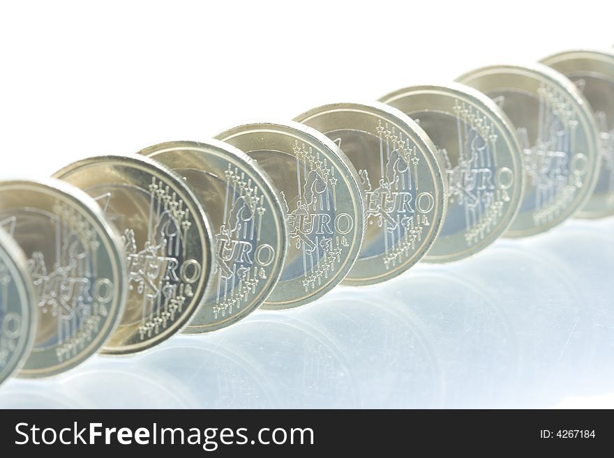 Euro coins line pattern with reflection. Euro coins line pattern with reflection