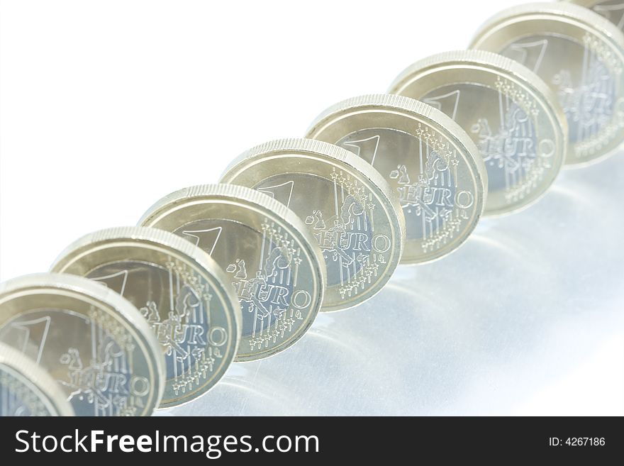 Euro coins line pattern with reflection. Euro coins line pattern with reflection