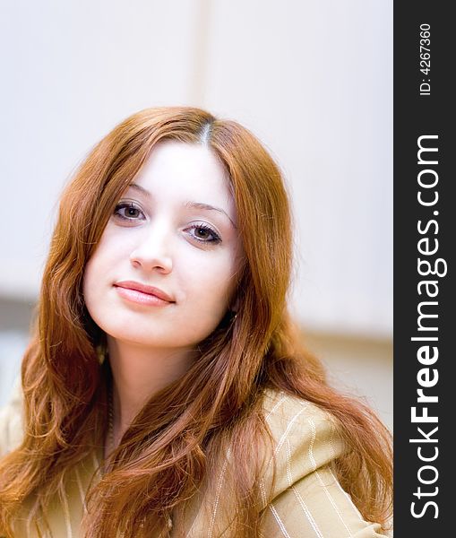 Girl with reddish hair in office