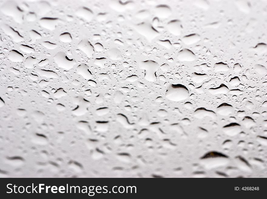 Drops of a rain on glass, liquid. Drops of a rain on glass, liquid