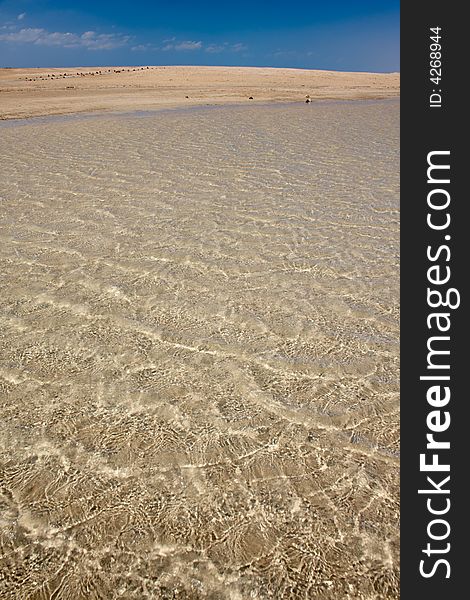 Warm sea water on sand beach in Egypt
