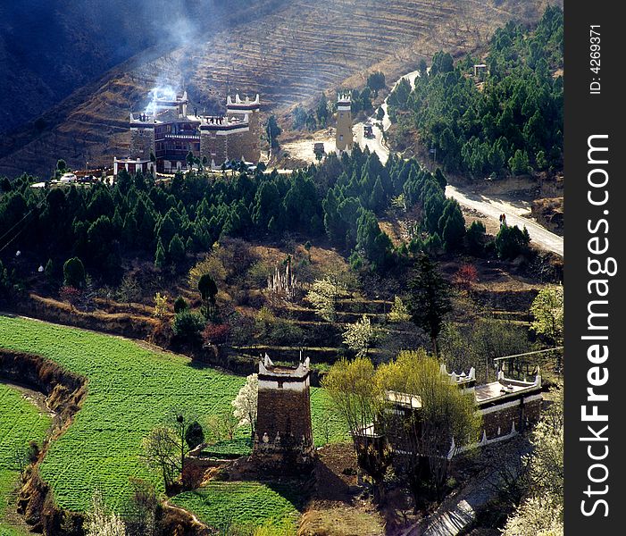 This photo is from Danba Qiang People Autonomous regions, Sichuan Provience, China.

Qiang People is one of the 55 minorities in China. They have a tradition of building castle(or towers) around there village. Because of the conflict around them.

But these castles no longer serve their origional purpose any more nowadays. The battlefield around the castles became farm,and the smoke in this picture is cooking smoke, instead of battle-warning smoke. This photo is from Danba Qiang People Autonomous regions, Sichuan Provience, China.

Qiang People is one of the 55 minorities in China. They have a tradition of building castle(or towers) around there village. Because of the conflict around them.

But these castles no longer serve their origional purpose any more nowadays. The battlefield around the castles became farm,and the smoke in this picture is cooking smoke, instead of battle-warning smoke.