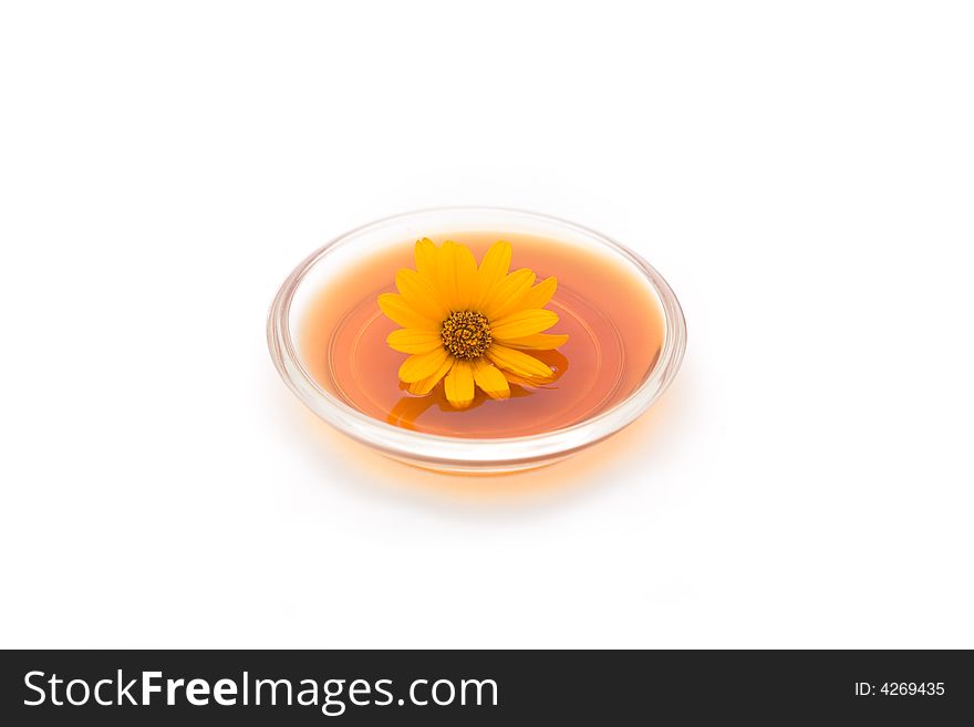 Herbal drink with flower isolated on white