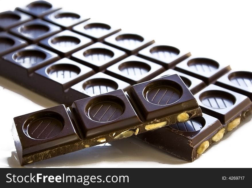 Squares of dark chocolate with almonds