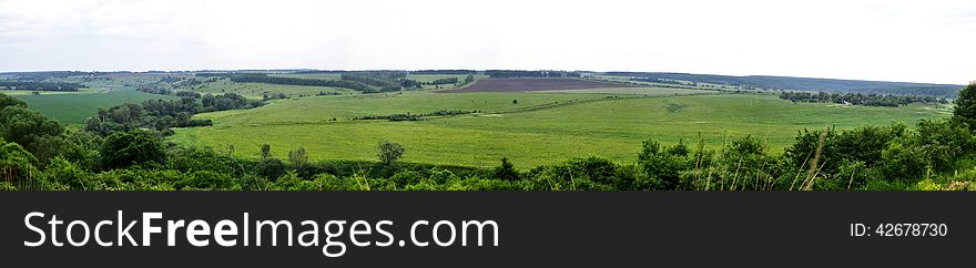 Panorama of natural areas with fields, roads and forest plantations. Panorama of natural areas with fields, roads and forest plantations