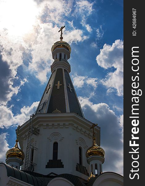 Church of St. Alexander Nevsky on the background of the cloudy sky. Church of St. Alexander Nevsky on the background of the cloudy sky