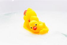 Three Rubber Ducks In Foam Water Stock Photography