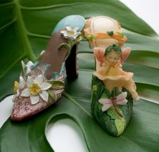 Thumbelina And Bud  Shoes Together Stock Photography