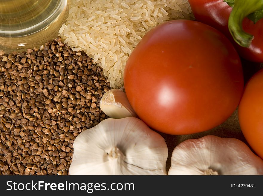 Healthy food : rice, groats, garlic, tomato