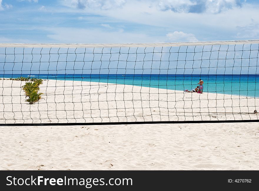 The volleyball net on Playa Furia beach on Cozumel island, Mexico. The volleyball net on Playa Furia beach on Cozumel island, Mexico.