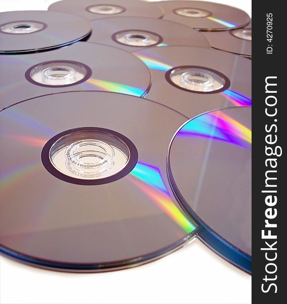 A number of compact discs arranged together over a white background