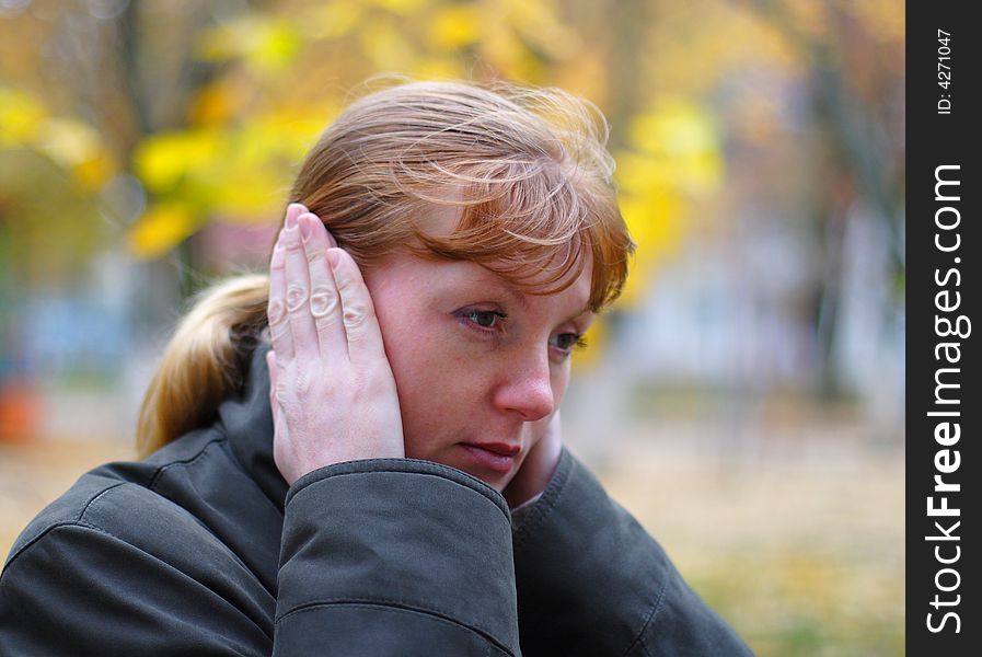 Woman cover your ears by hands