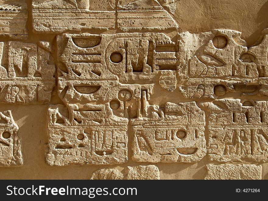 Hieroglyphic bas-relief in Medinet Habu ancient temple, Egypt, Luxor. Hieroglyphic bas-relief in Medinet Habu ancient temple, Egypt, Luxor