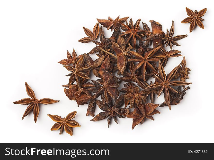 Stack of anise stars isolated on white.