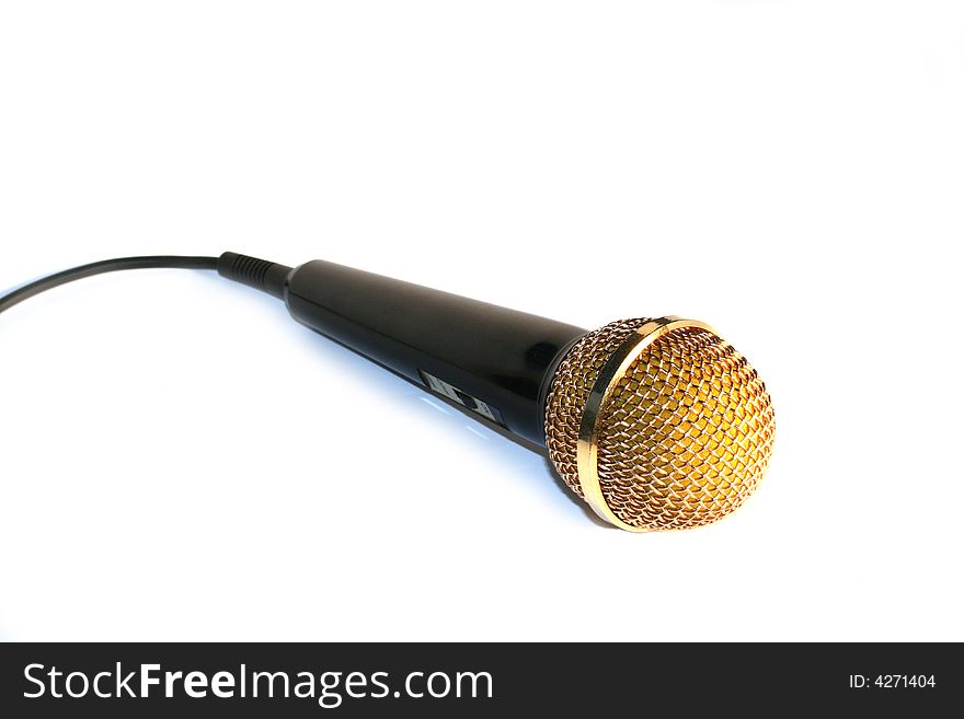 Golden microphone isolated on white background
