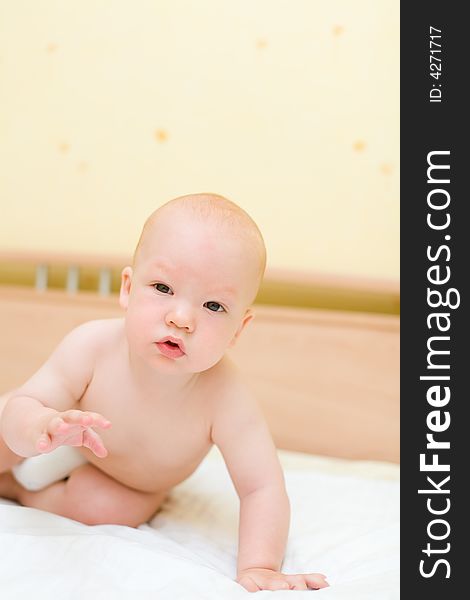 Toddler crawling on bed #2. Toddler crawling on bed #2