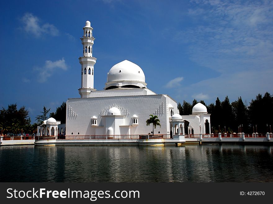 Flouting mosque on the blue sky background