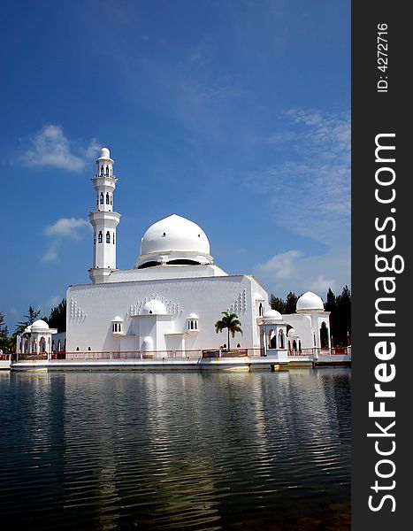 Flouting mosque on the blue sky background