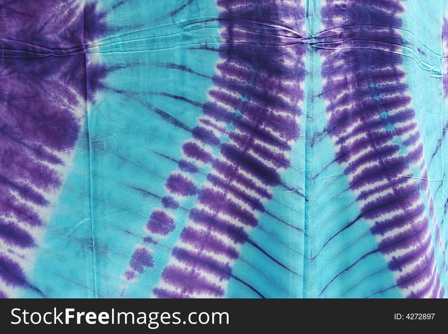 Purple and blue tie dyed material. Purple and blue tie dyed material.