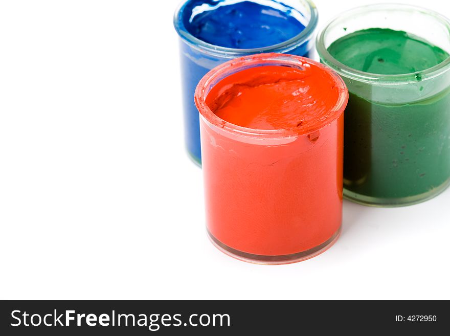Three opened jar with gouache paints red green blue. Three opened jar with gouache paints red green blue
