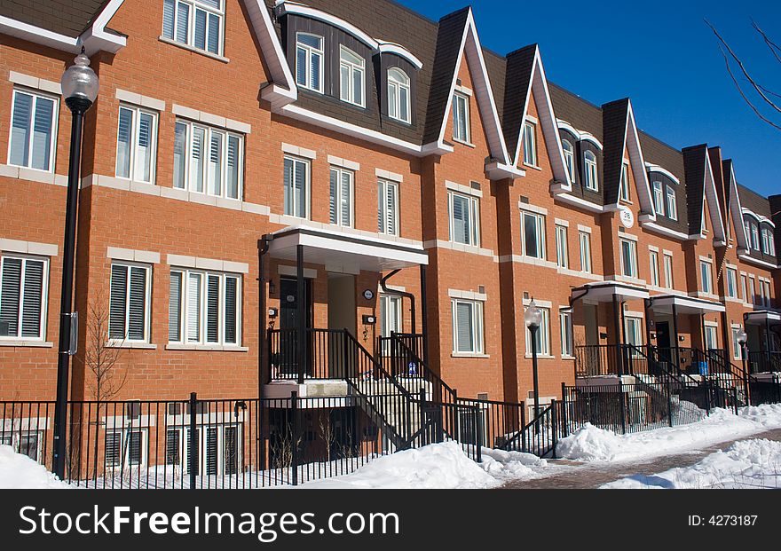 Winter scene of new brick townhouses. Winter scene of new brick townhouses