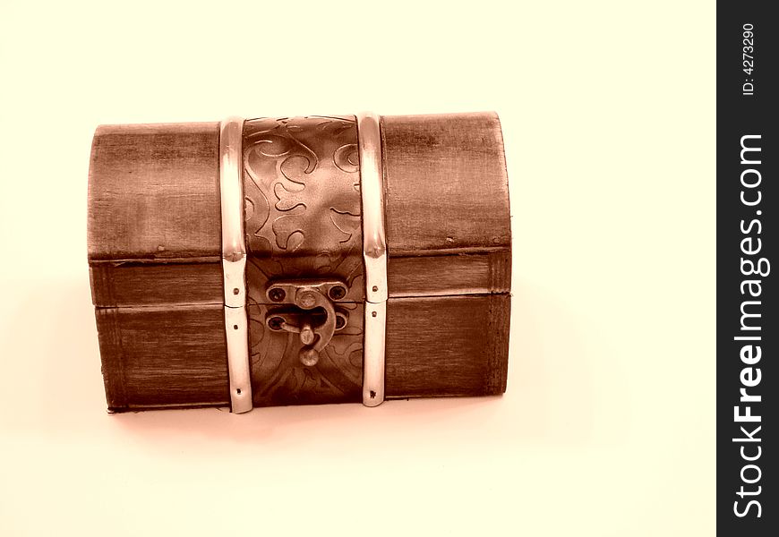 Closed treasure chest. Wood and metal.