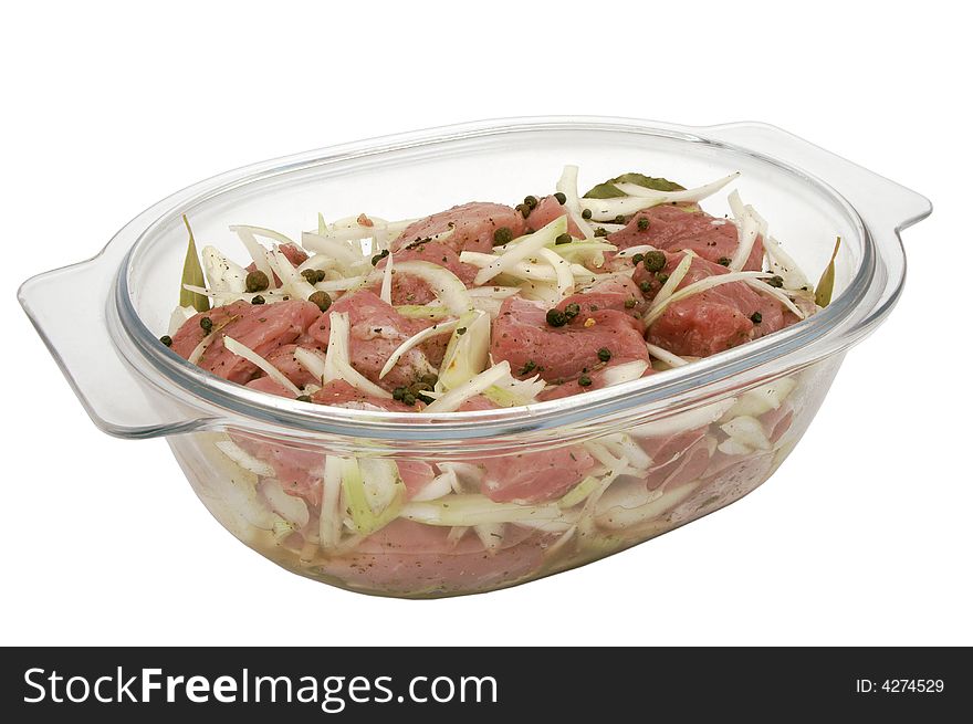 Meat in glass plate, at white background