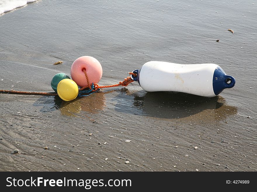 A buoy washed up on the beach after a big storm