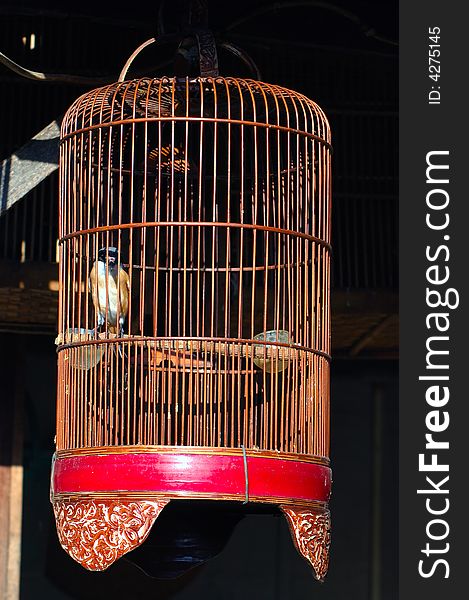 Indonesia, Java:red painted  bird cages. Indonesia, Java:red painted  bird cages