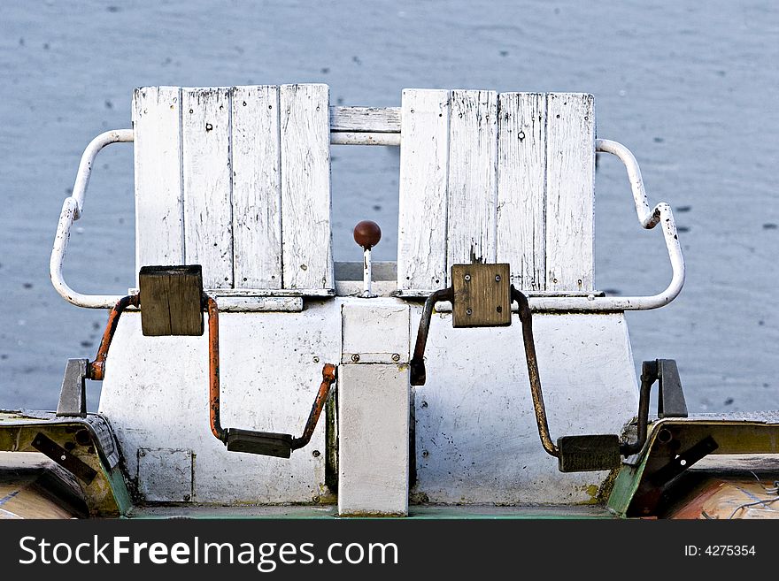 Old catamaran in winter and frozen lake