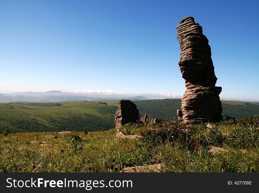 This is the stone forest in Keshiketeng Banner, inner-mongolia china. In each hill, there are many bits and pieces of stones on it. This is the stone forest in Keshiketeng Banner, inner-mongolia china. In each hill, there are many bits and pieces of stones on it.