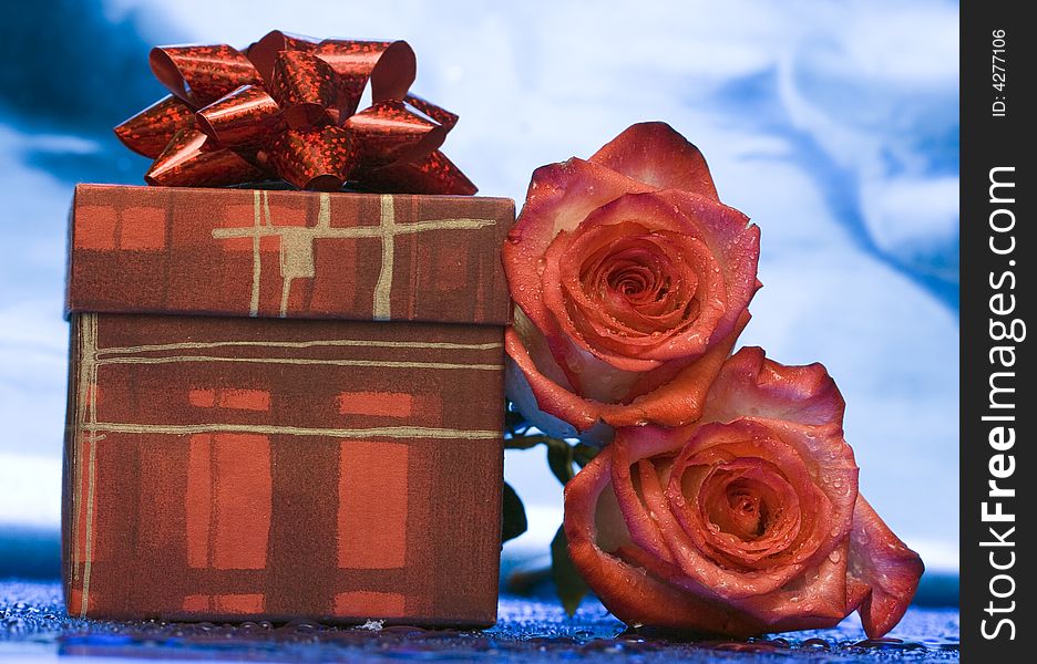 Gift box and red roses